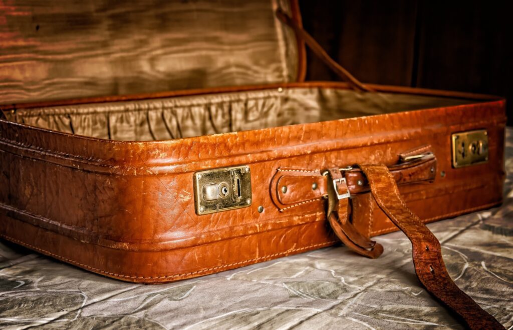 Open luggage on a bed