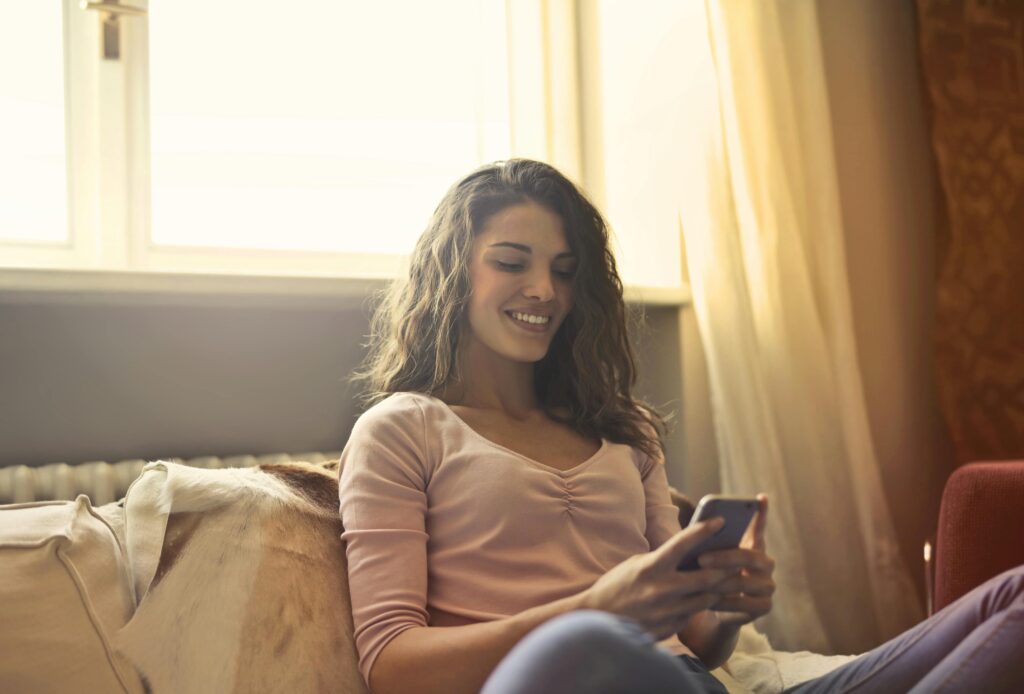 woman reading her text messages