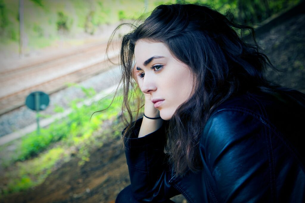 A pensive woman looking outdoors