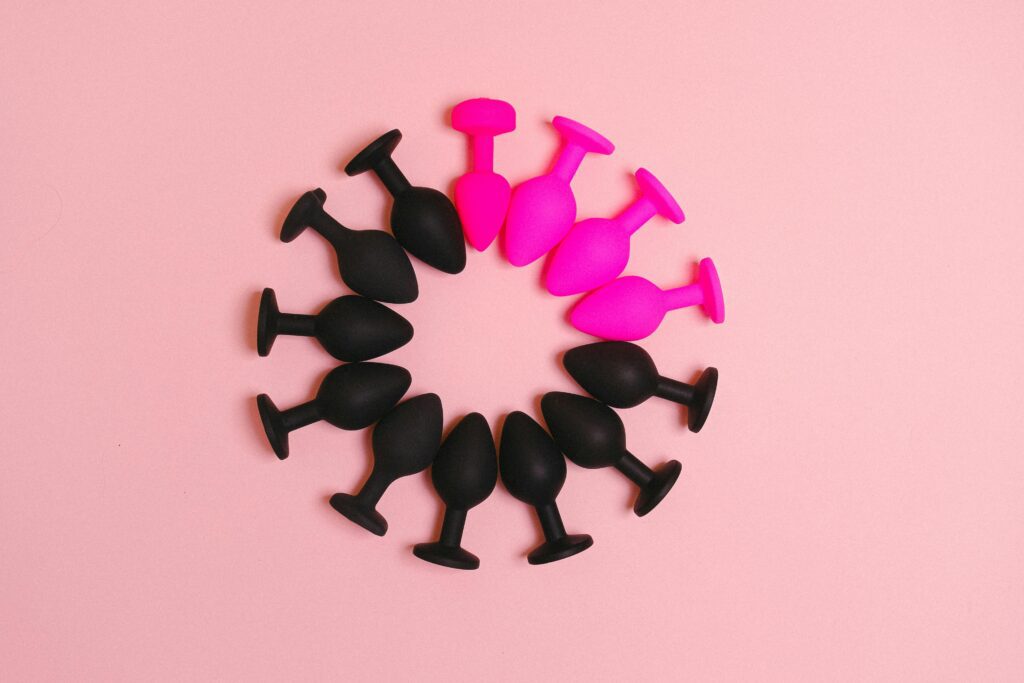 Pink and black butt plugs